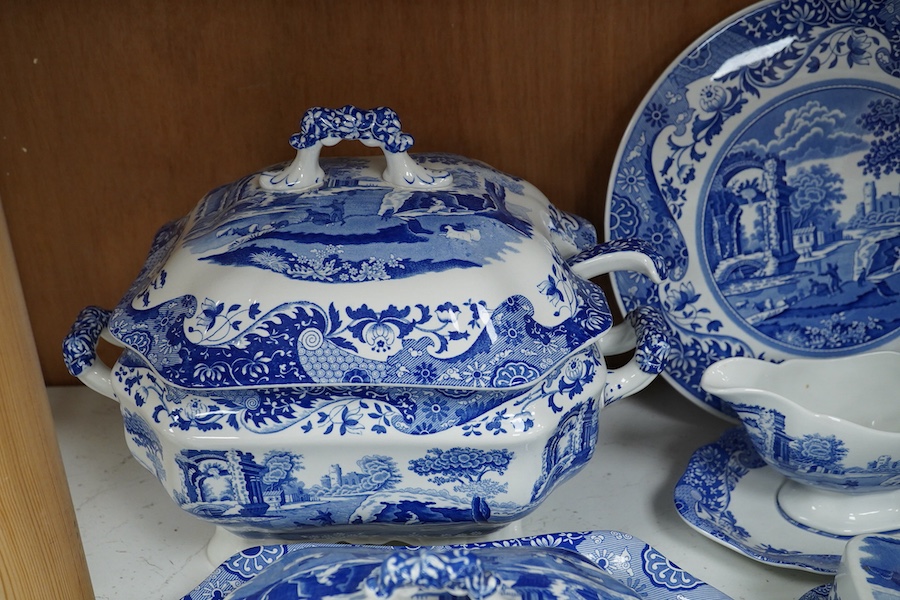 A quantity of Spode Italian dinner ware to include tureens, twin handled soup dishes and platters and a circular bread plate, largest 35cm wide